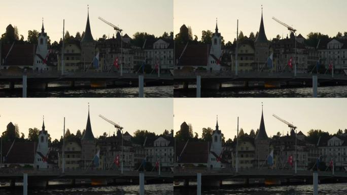 日落时间卢塞恩城市景观交通河滨大桥慢动作全景4k瑞士