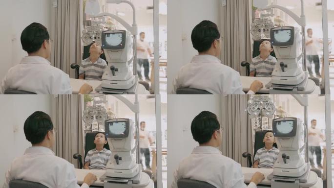 验光师用光学测光仪测量男孩的视力-股票视频