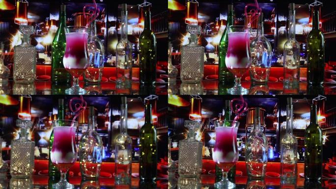 新年和圣诞派对概念。不同的美味鸡尾酒，背景上有创意的新年假期艺术品装饰。彩色玻璃杯鸡尾酒。派对俱乐部