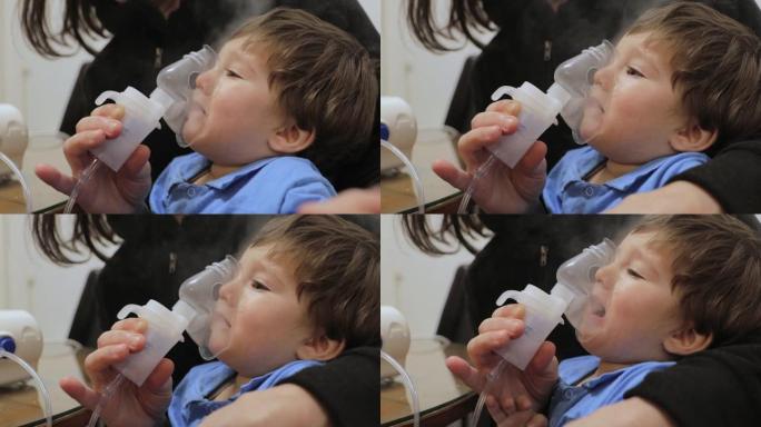 有流感或感冒症状的男婴吸入。生病的小孩被吸入。带吸气面罩在家吸气
