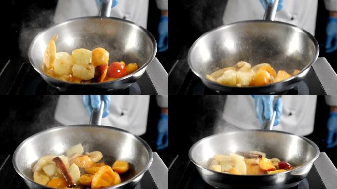 餐厅用水果烹饪弗拉布甜点: 香蕉、杏子和桃子。厨师搅拌焦糖水果煎锅。美味甜点的烤配料。慢动作。高清