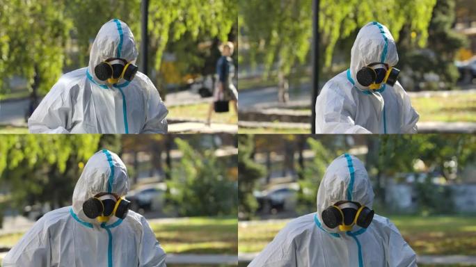 穿着防护服的消毒器的人将消毒剂喷洒在扶手上，并用餐巾纸将其擦拭掉。消毒服务人员对城市街道上的公共场所