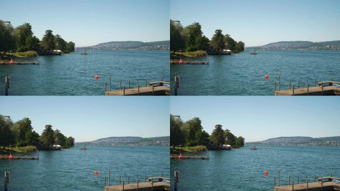 阳光明媚的时间苏黎世市湖滨拥挤海滩慢动作全景4k瑞士