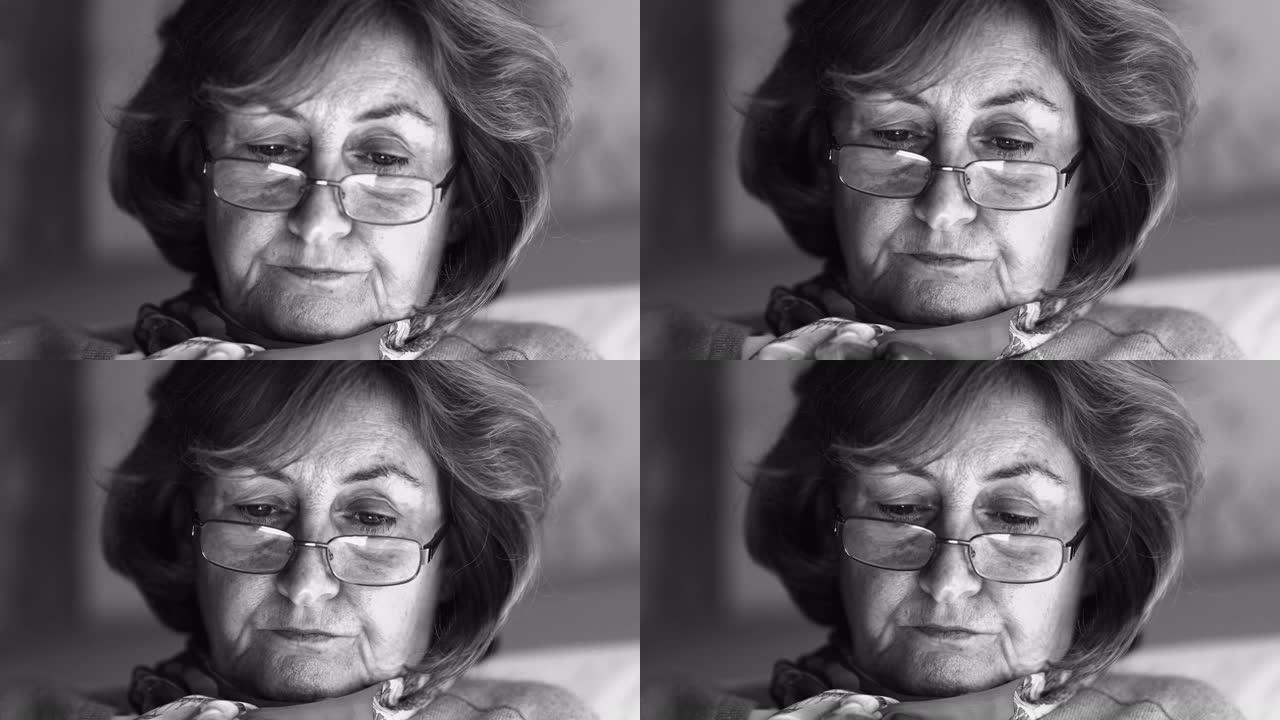 60多岁的老妇人戴着老花镜的戏剧性特写