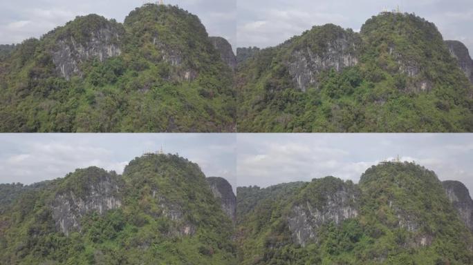 泰国甲米虎穴寺顶佛陀的航拍画面，青石岩，山。