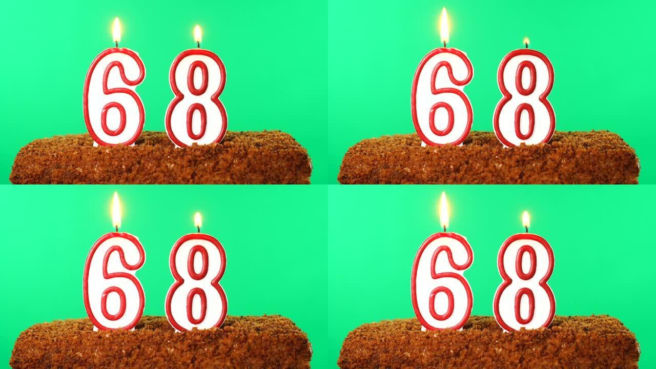 68号点燃蜡烛的蛋糕。色度键。绿屏。隔离