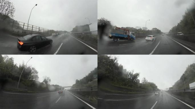 雨天开车。大雨中的交通，高速公路上的交通。镜头上的雨滴