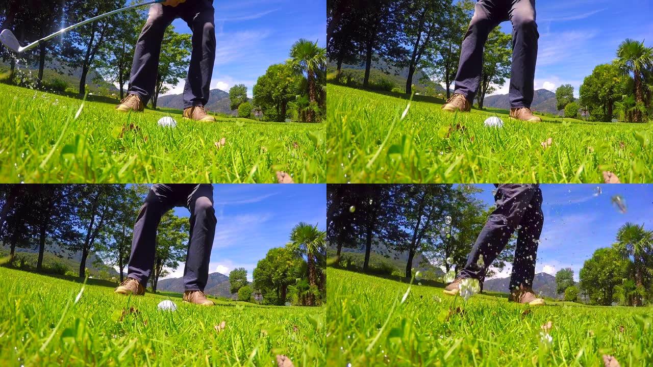 高尔夫球手在慢动作的湿草地上用高尔夫楔子射击
