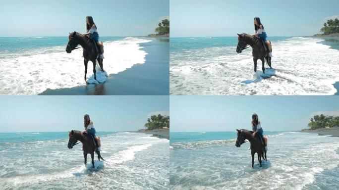 可爱的中国少年在巴厘岛的海滩上骑马