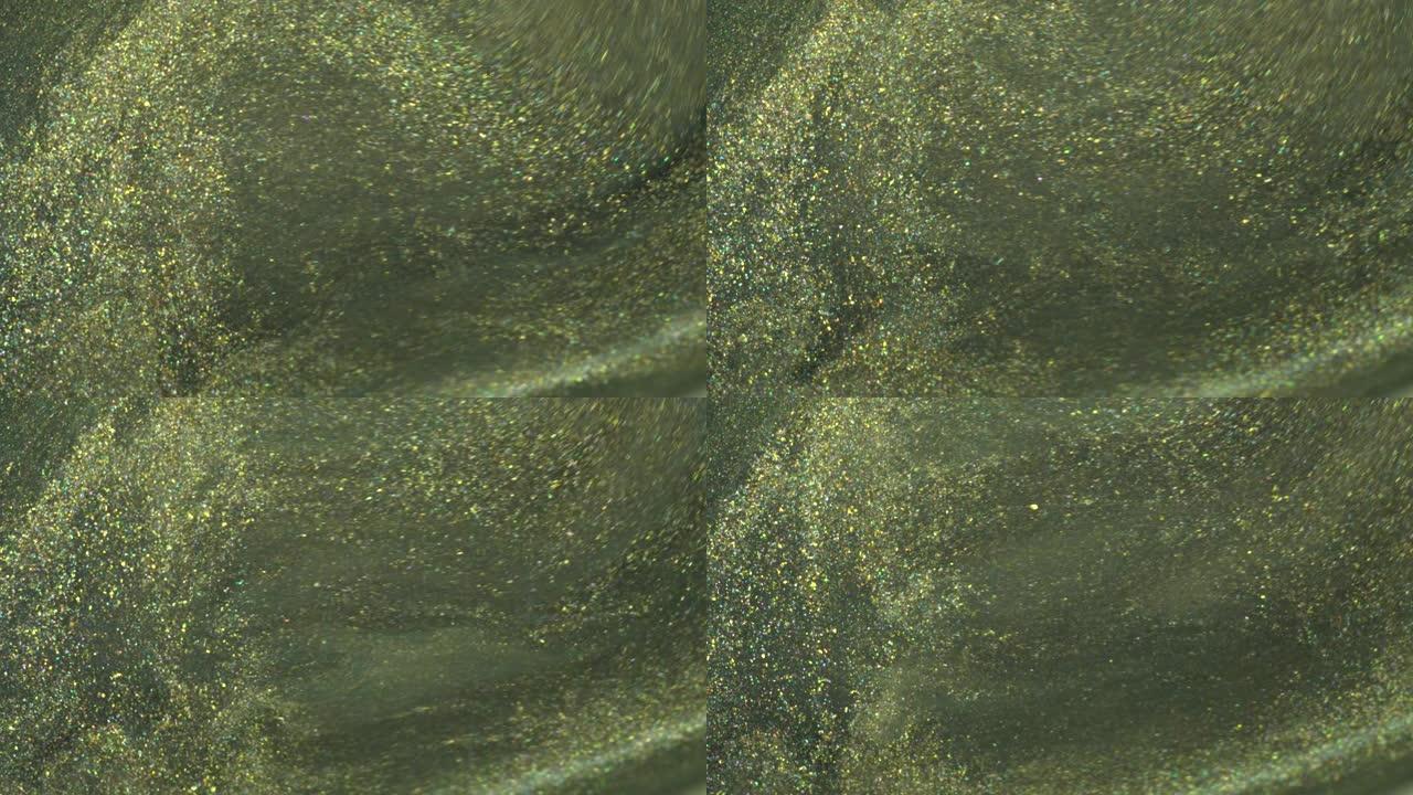 橄榄绿色和黑色金色亮片。闪光丙烯酸涂料流动。液体闪光纹理。闪亮的背景