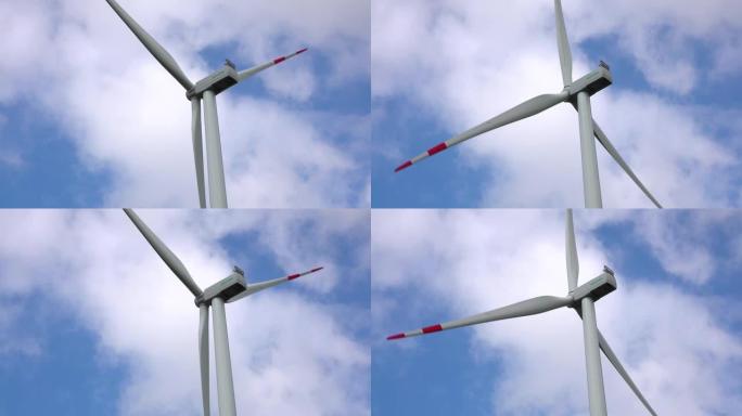 风磨，云和蓝天。产生可再生清洁能源的风力涡轮机。