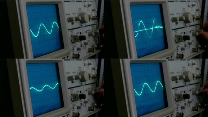 示波器上的振幅图。一个男人按下设备上的按钮。几何线改变形状