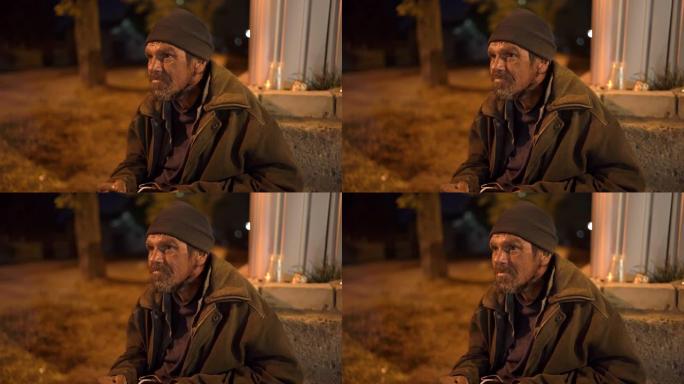 晚上街上孤独寒冷的无家可归者的脸。