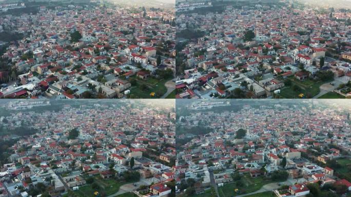 塞浦路斯拉纳卡著名地标山谷帕诺莱夫卡拉村的鸟瞰图，橙色陶瓷屋顶，无人机镜头