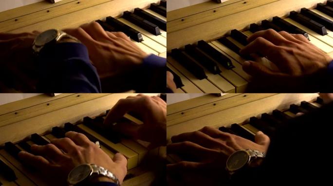 一位专业的钢琴家演奏钢琴。双手合拢。