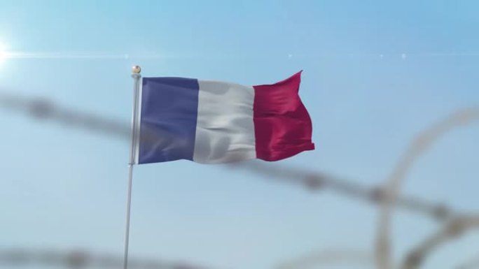 铁丝网后面飘扬着法国国旗