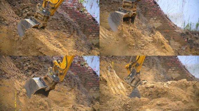 挖掘机的铲斗挖地