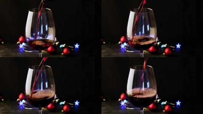 在黑暗的节日背景上倒入红酒，并带有五颜六色的bokeh