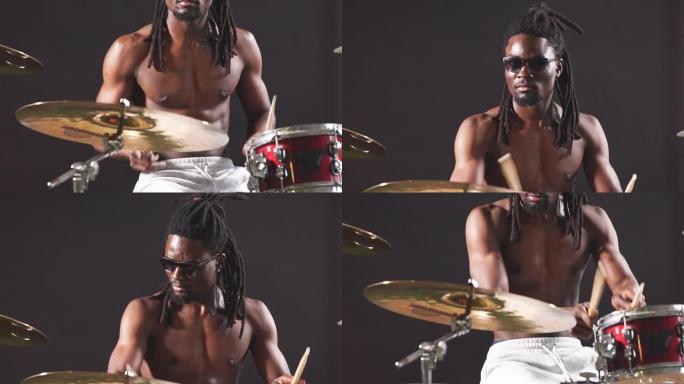好看的艺术非洲黑人男性鼓手喜欢打鼓