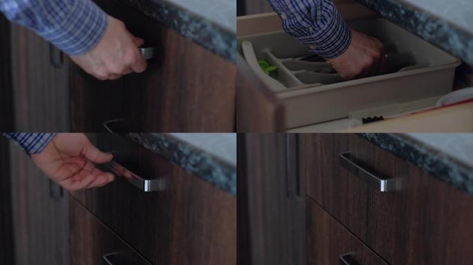 男人的手打开厨房的储物柜