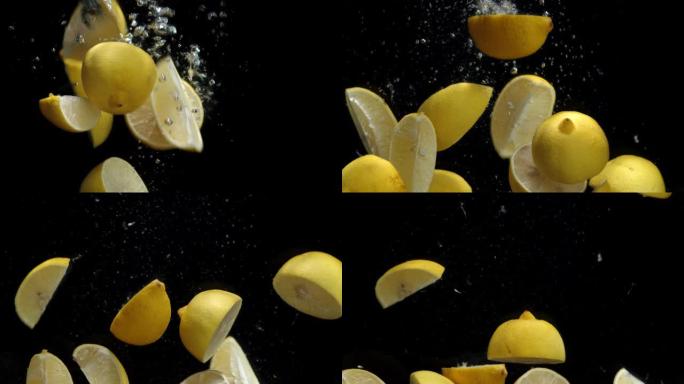 柠檬片落在有气泡的水下。