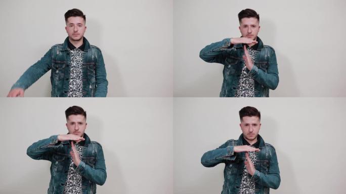 有吸引力的年轻白人男子做暂停，休息，暂停手势