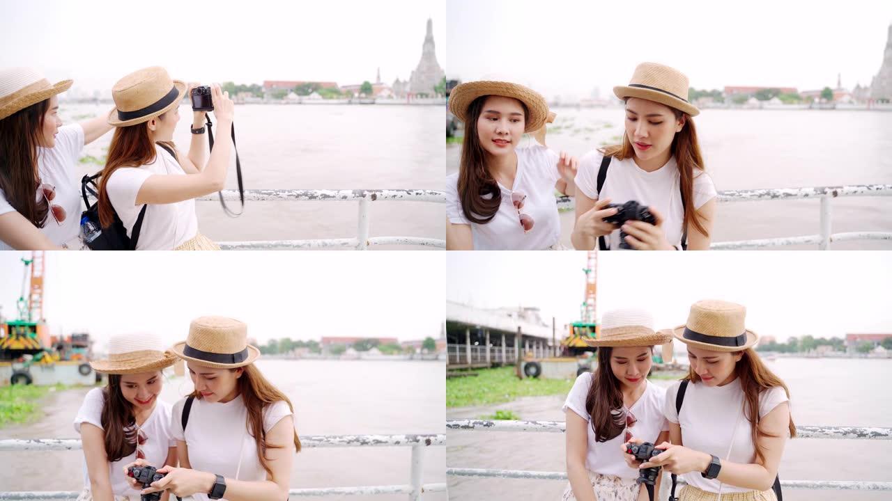 妇女正在射击。女孩乘船过河，参观泰国受欢迎的旅游胜地黎明寺。