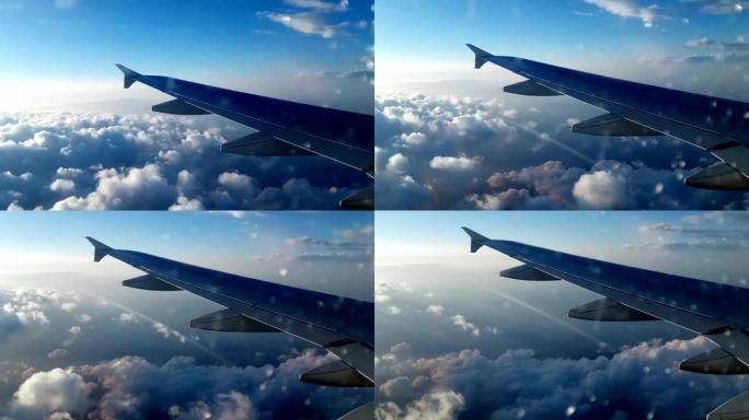 云层上的飞机机翼机翼大气层坐飞机