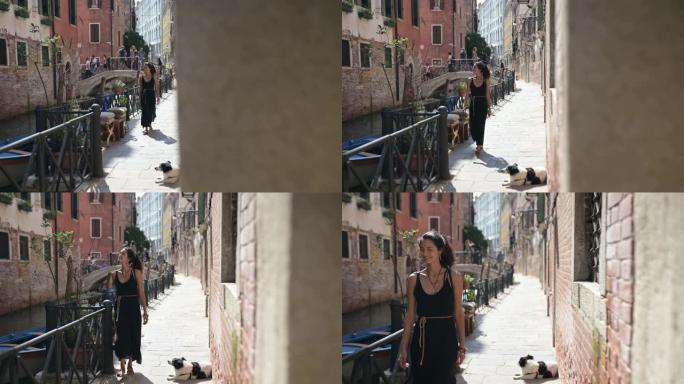 年轻的拉丁女子在威尼斯的香奈儿 (chanel) 上行走