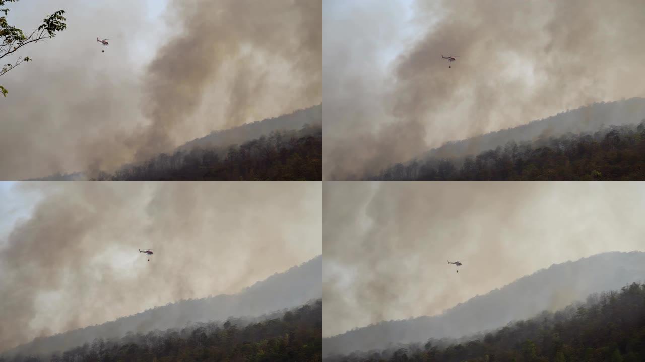 消防直升机携带水桶。扑灭森林大火