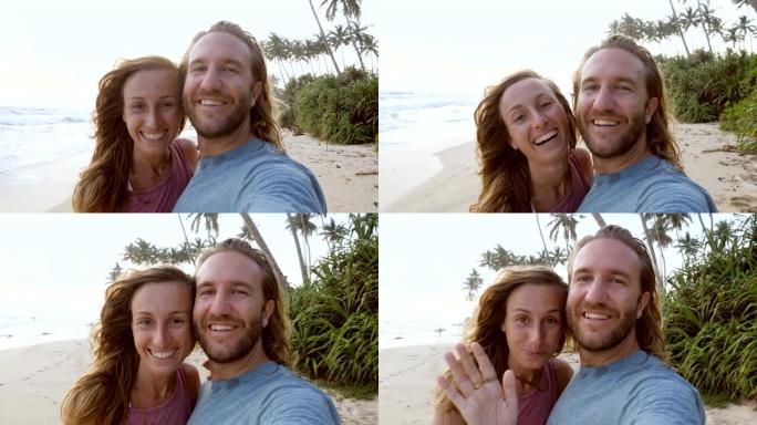 日落时在海滩上自拍的年轻夫妇在网上视频聊天中向朋友问好。两个人在热带度假中自拍很酷