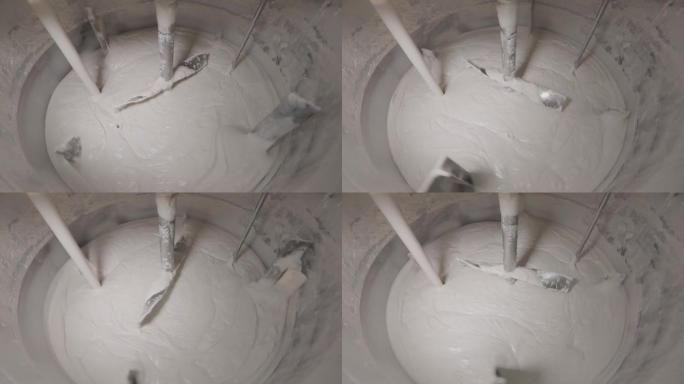 在工厂里搅拌奶油。奶油制备过程。化妆品霜的制备。