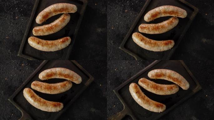 油炸香肠在切菜板上缓慢旋转。