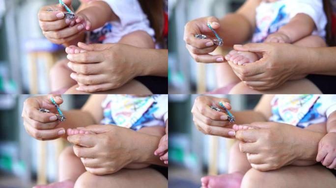 母亲为新生婴儿剪指甲