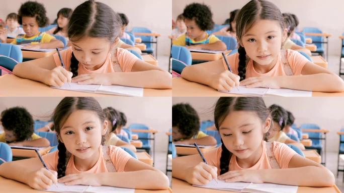 漂亮的小女孩在教室里学习