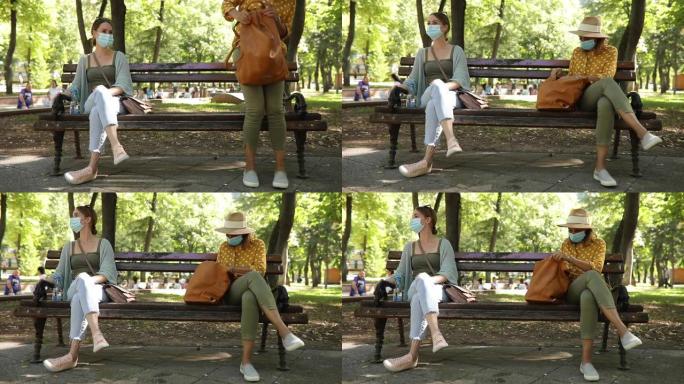 两名妇女在公园维持社会距离规则
