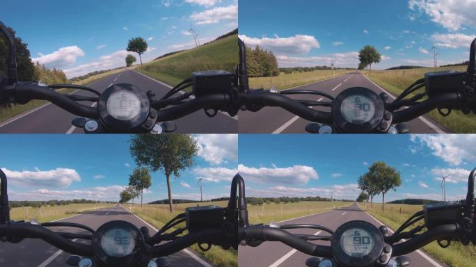 现代扰频器摩托车在林道骑行。在摩托车之旅中驾驶空旷的道路玩得开心。