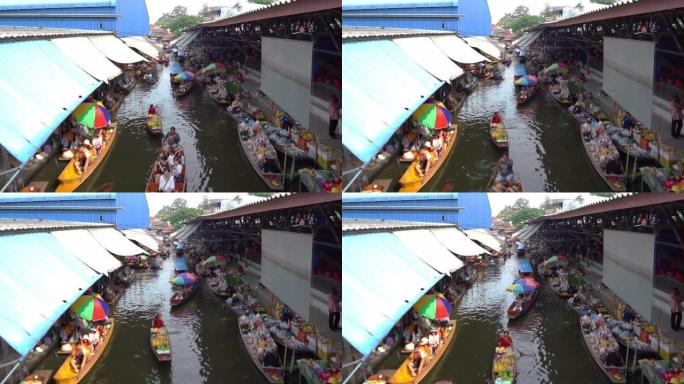 在泰国Ratchaburi区的Damnoen Saduak浮动市场，当地人在船上出售水果，食物和纪念