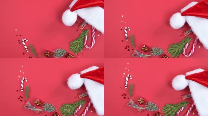 圣诞背景360度旋转。带有装饰的圣诞老人帽子和红色背景上旋转的杉木树枝