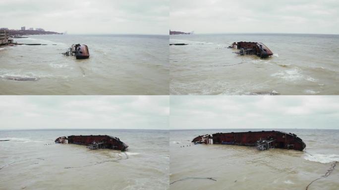 在敖德萨黑海海岸失事的沉没货船油轮的空中俯视图，无人机正在靠近船飞行