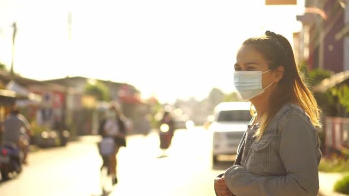 亚洲妇女戴着防尘口罩，PM 2.5和防病毒新型冠状病毒肺炎