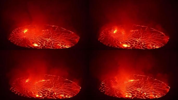 在充满烟雾的活火山Nyiragongo火山口中的熔岩湖特写镜头