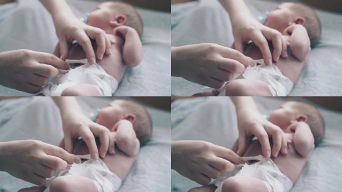 母亲双手治疗新生儿脐带护理