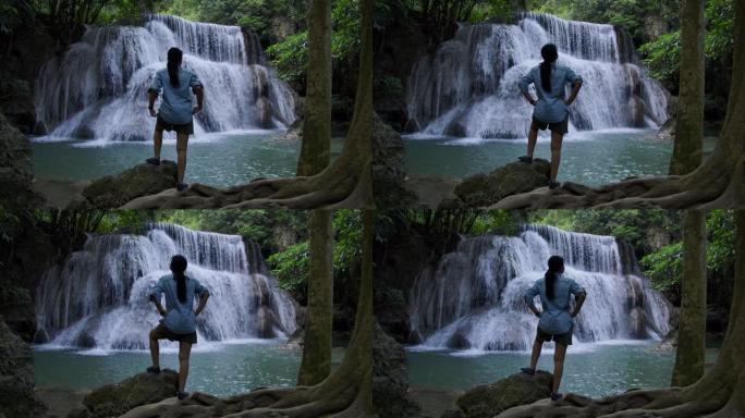 站在瀑布前欣赏泰国自然之美的女人teeanger