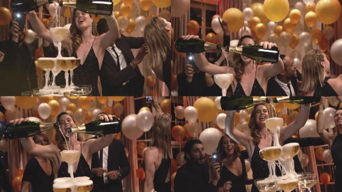 派对上美丽的女人在眼镜金字塔里倒香槟