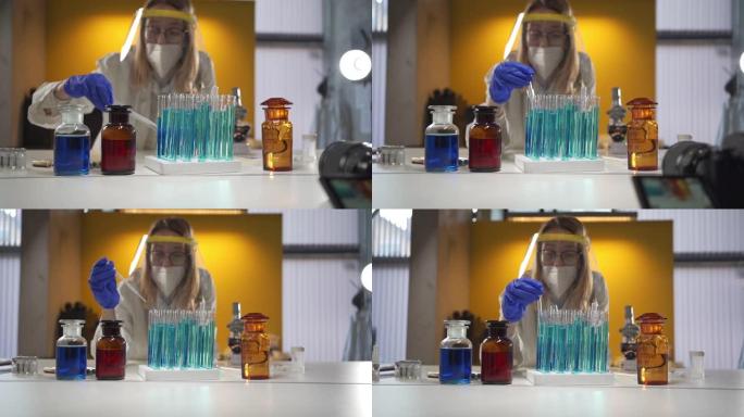 科学家在实验室中移液，同时混合蓝色化学物质的样品