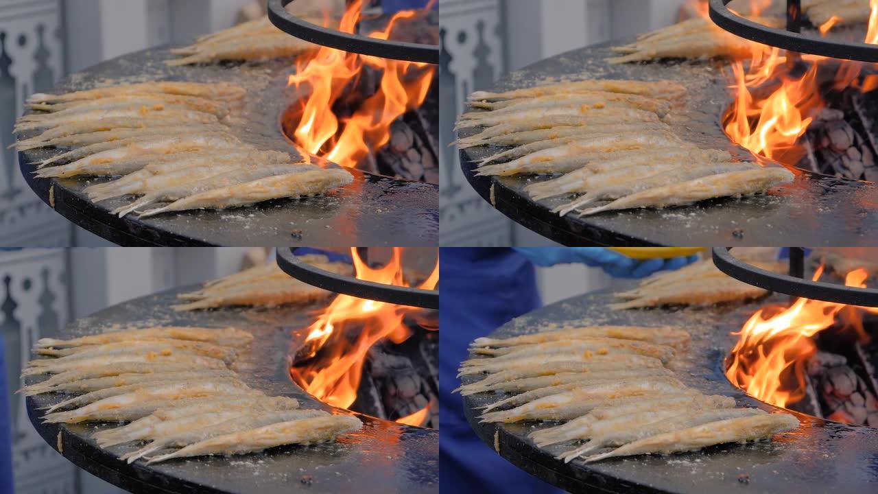 慢动作: 在美食节上用黑色烹饪欧洲臭鱼的过程