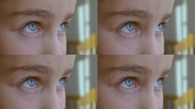 近距离看孩子的蓝眼睛。微距镜头打开和关闭蓝眼睛小女孩。儿童眼睛的特写动作。人眼虹膜开放瞳孔。