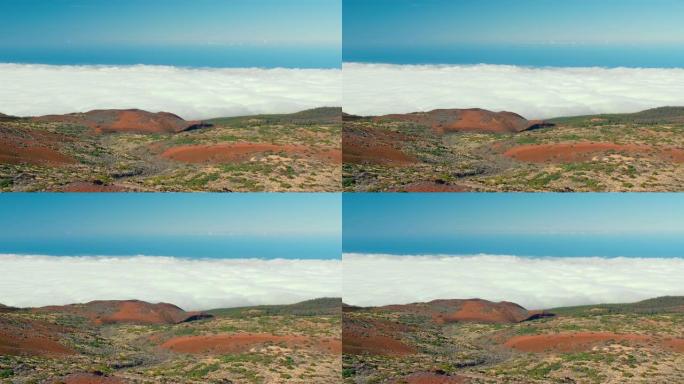 在加那利群岛泰德火山顶部艰难徒步旅行后，云层之上。艰难的一天徒步到火山山顶，从上面看，底部隐藏在云层