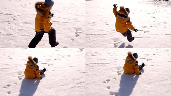 一个小男孩在白雪覆盖的公园里玩耍，他在雪地上跳跃和摔倒。
